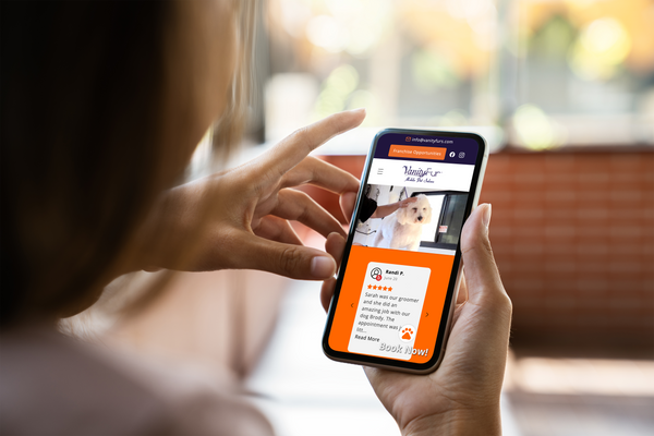 Person using a smartphone with a pet care app displayed on the screen.